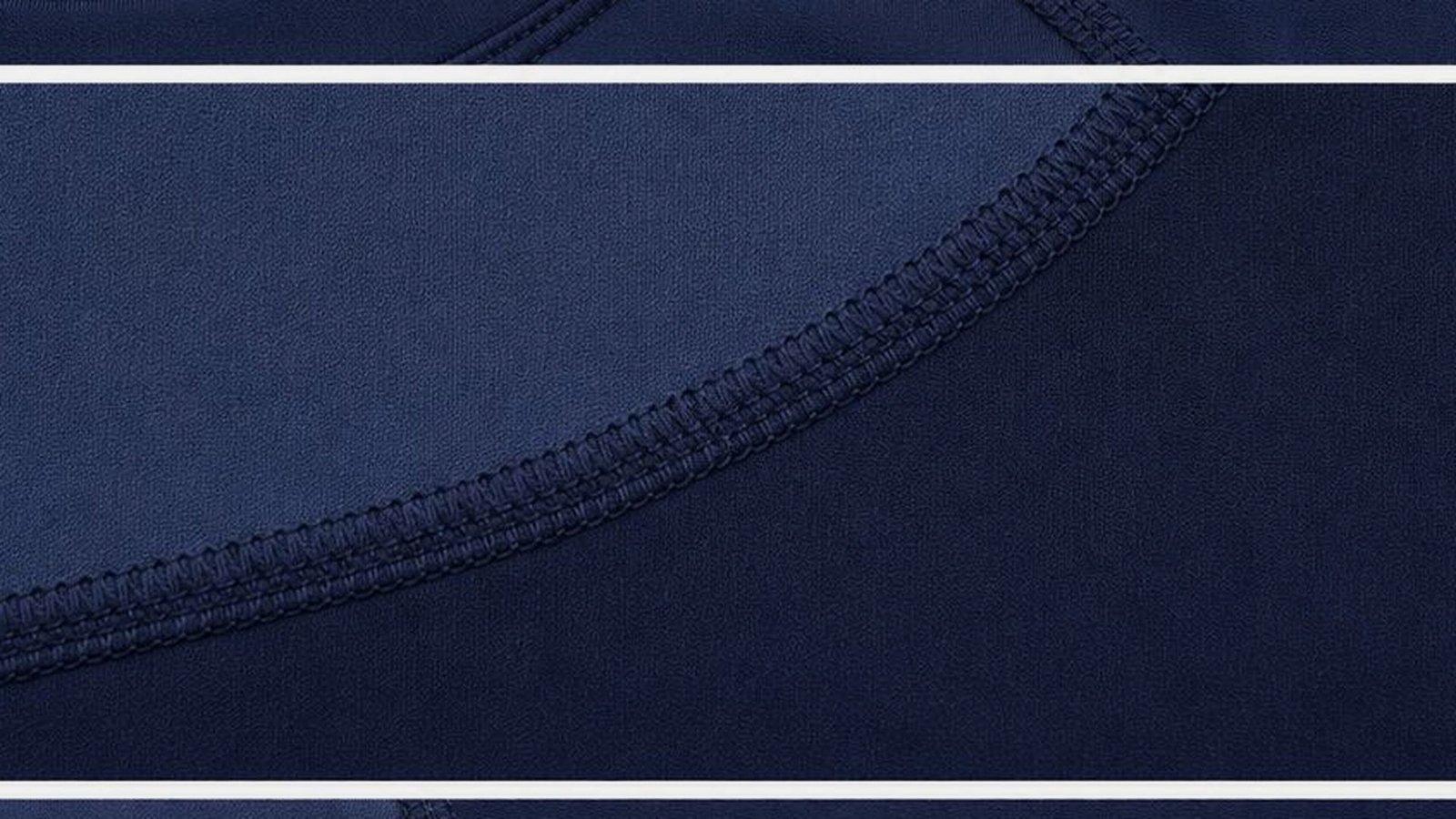 Close inspection detail of navy panel seams and stitch density